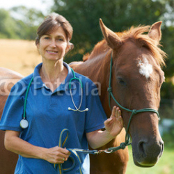 Portrait-Of-Female-Vet-In-Field-With-Horse.jpg